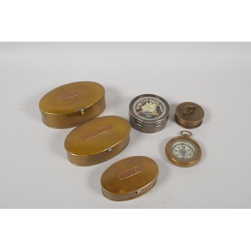 194 - Three brass compasses and a set of three nesting brass drug boxes, largest 12 x 8cm