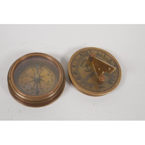 194 - Three brass compasses and a set of three nesting brass drug boxes, largest 12 x 8cm