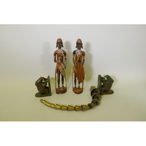 198 - A pair of African carved wood Massi figures, a pair of carved and painted wood elephant bookends and... 