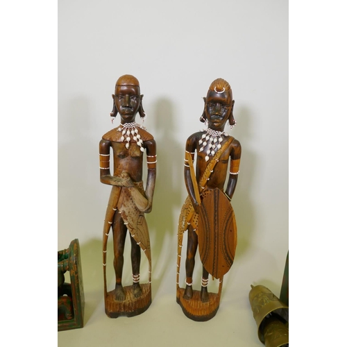 198 - A pair of African carved wood Massi figures, a pair of carved and painted wood elephant bookends and... 