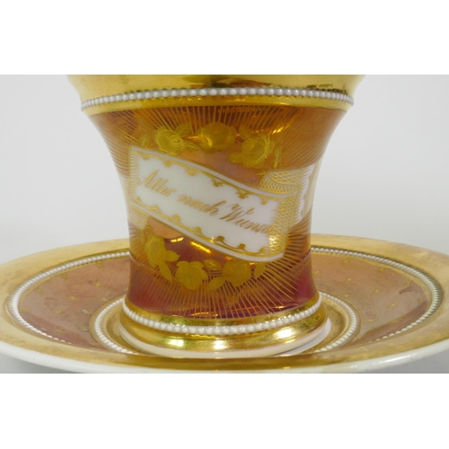 20 - A C19th Vienna lustre and gilt cup and saucer, inscribed 'Alles nach Wunsch' (everything as you desi... 