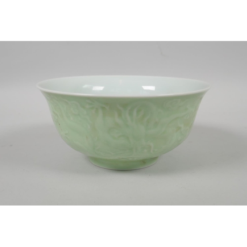 203 - A Chinese celadon glazed porcelain bowl with raised underglaze dragon decoration, 5 character mark t... 