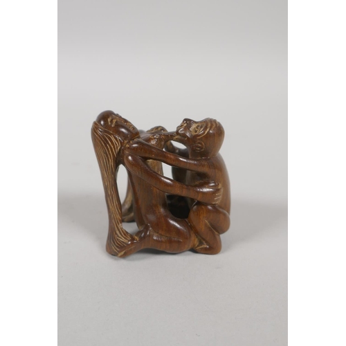 206 - A Japanese carved wood erotic shunga netsuke, signed in an inset cartouche to base, 4.5cm