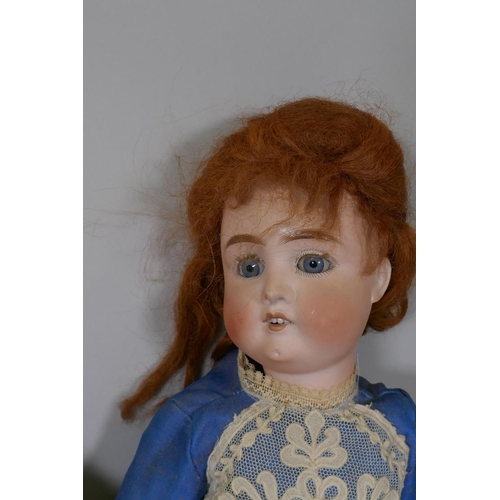 207 - Four porcelain head dolls, an Armand Marseille 991 doll with rolling eyes and open mouth, compositio... 