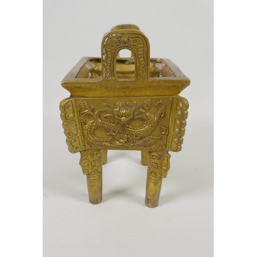 208 - A Chinese gilt metal two handled censer with raised dragon and flaming pearl decoration, 16cm high