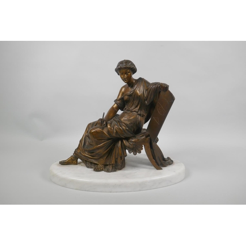 21 - A C19th/early C20th gilt bronze figure of a female scholar on a marble base, 29cm high