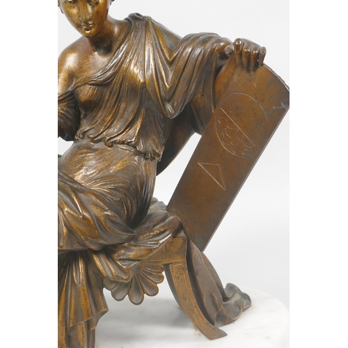 21 - A C19th/early C20th gilt bronze figure of a female scholar on a marble base, 29cm high