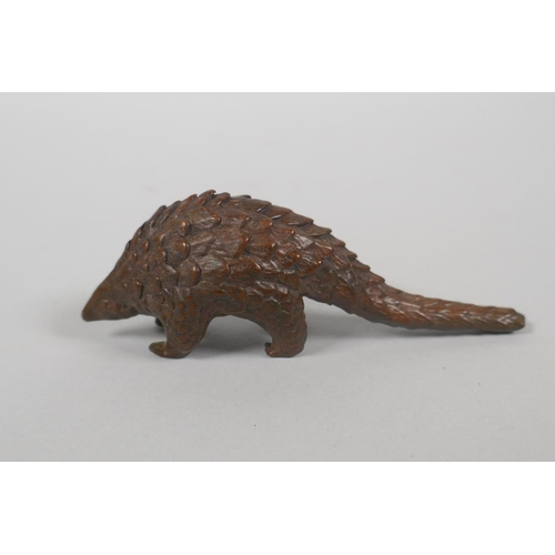 210 - An Oriental miniature bronze figure of a pangolin, 10cm 