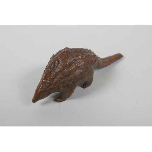 210 - An Oriental miniature bronze figure of a pangolin, 10cm 