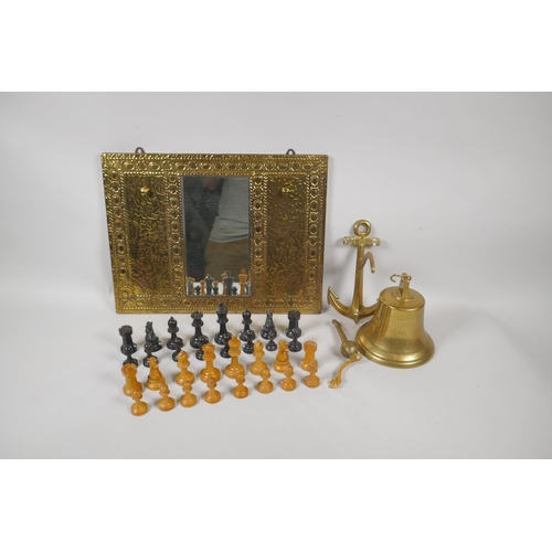 212 - A brass hall mirror with hooks and ship's bell, 22cm long, and a set of boxwood and ebony chess piec... 