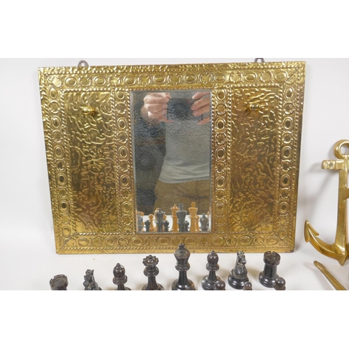 212 - A brass hall mirror with hooks and ship's bell, 22cm long, and a set of boxwood and ebony chess piec... 