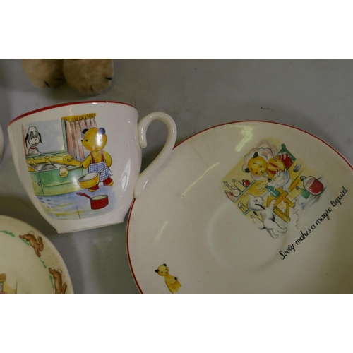 217 - A vintage stuffed plush toy dog with swivel head and a Merrythought dog, Bunnykins mug and plate, So... 