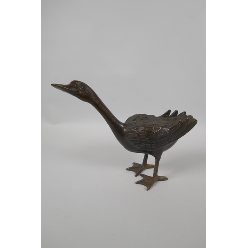 222 - A filled bronze figure of a goose, 22cm high