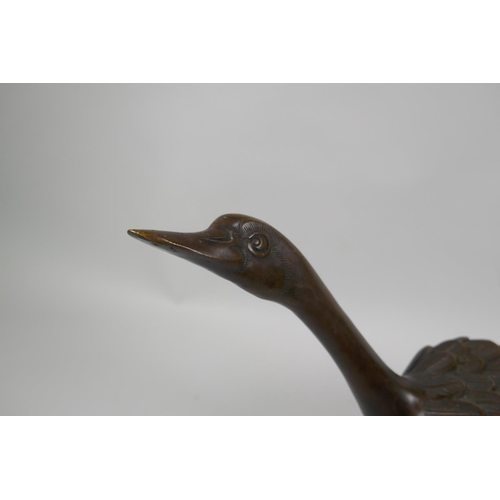 222 - A filled bronze figure of a goose, 22cm high