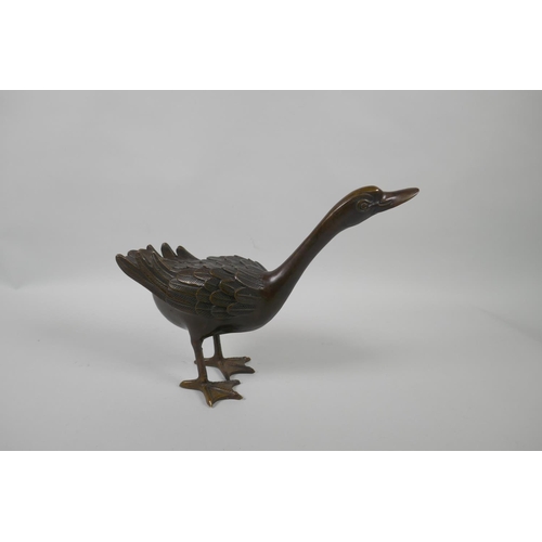 222 - A filled bronze figure of a goose, 22cm high