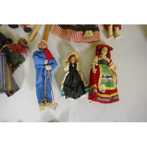 224 - A collection of antique dolls, Dutch, French, Scandinavian, including three Indian women in saris