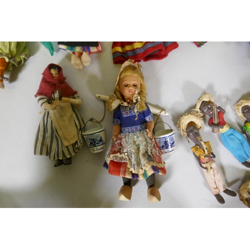 224 - A collection of antique dolls, Dutch, French, Scandinavian, including three Indian women in saris