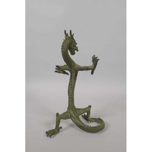 225 - A Chinese bronze figure of a dragon with gilt highlights, 24cm high