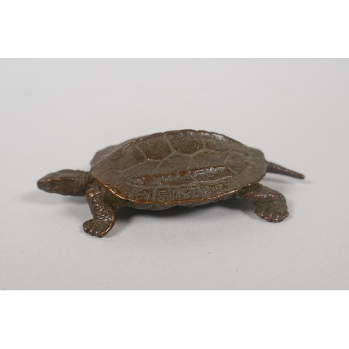 228 - A Japanese style bronze okimono tortoise, with character inscriptions to the shell, 8cm long