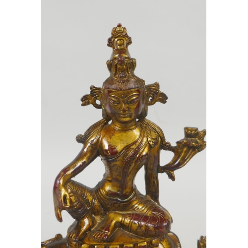 235 - A Tibetan gilt and coppered bronze figure of White Tara, 21cm high