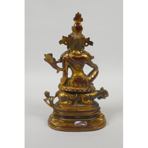 235 - A Tibetan gilt and coppered bronze figure of White Tara, 21cm high