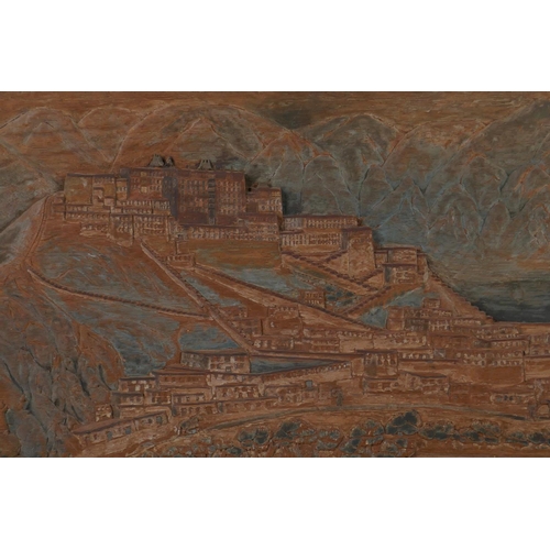 25 - A C19th Tibetan carved teak panel depicting The Potala at Lhasa, the lower right carved with an insc... 