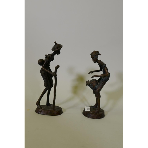 266 - A pair of African Burkina Faso bronze figures, a traveller and drum player, 28cm high