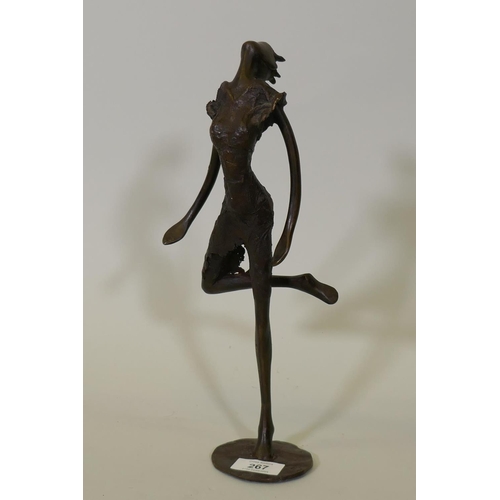 267 - An African Burkina Faso bronze figure of a dancer, marked TB?, 33cm high