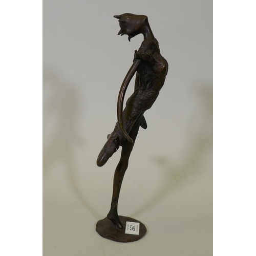 267 - An African Burkina Faso bronze figure of a dancer, marked TB?, 33cm high