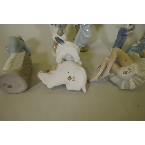 276 - Eight Nao porcelain figures, ballerina, girl with a dove, boy and puppies etc