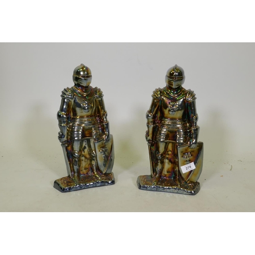 278 - A pair of early C20th lustre plated cast metal fireside companions, 35cm high