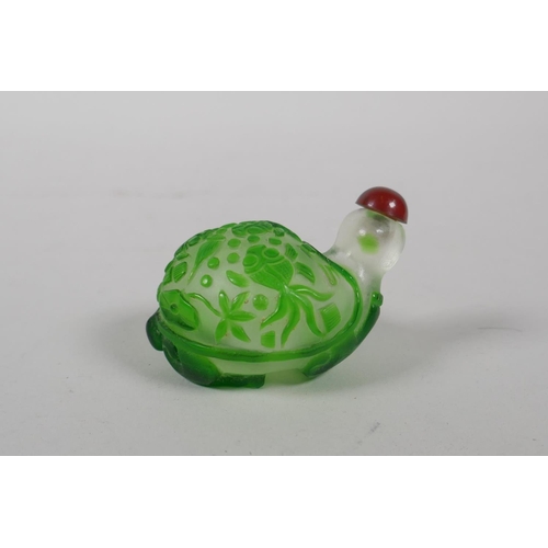 33 - A Peking glass snuff bottle in the form of a tortoise with carp decoration and character inscription... 