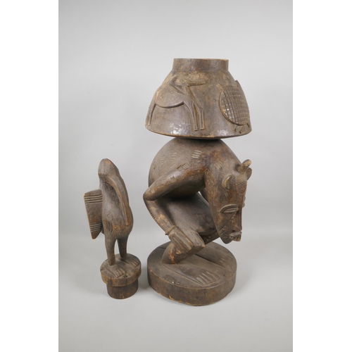 36 - An African Senufo Peoples carved wood figural offering vessel with a bird carved to the cover, 88cm ... 