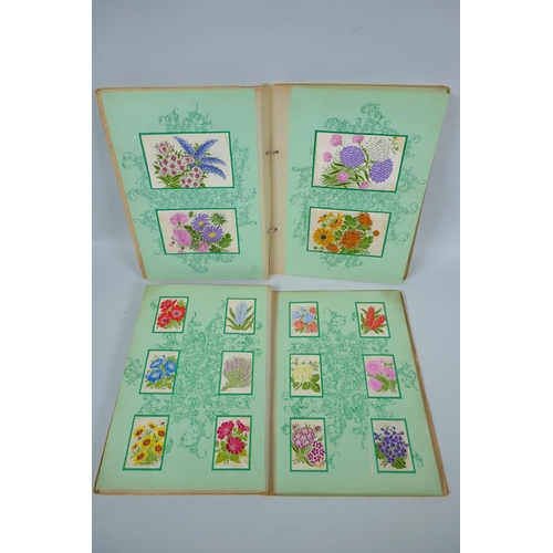 37 - Two albums of 1930s Kensitas Cigarettes silk flowers in two sizes, 5 x 7cm and 13 x 9cm