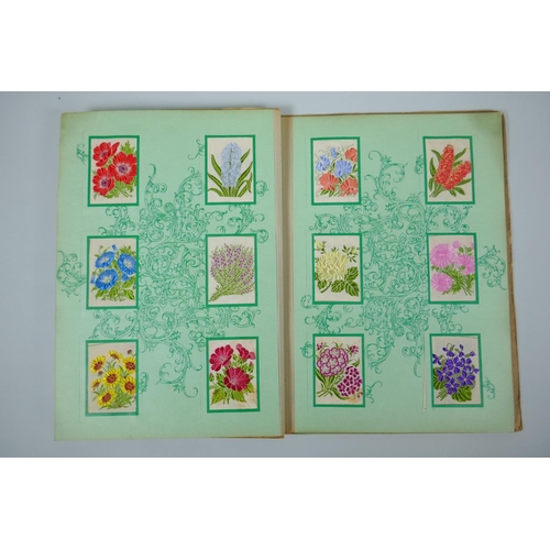 37 - Two albums of 1930s Kensitas Cigarettes silk flowers in two sizes, 5 x 7cm and 13 x 9cm