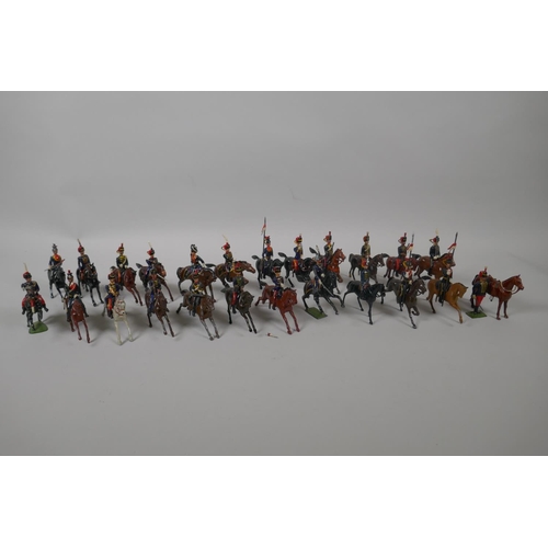 46 - Twenty five Britains mounted soldiers of various cavalry regiments, 9cm high