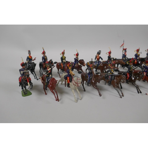 46 - Twenty five Britains mounted soldiers of various cavalry regiments, 9cm high