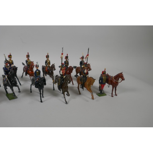 46 - Twenty five Britains mounted soldiers of various cavalry regiments, 9cm high