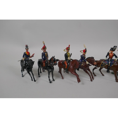 46 - Twenty five Britains mounted soldiers of various cavalry regiments, 9cm high