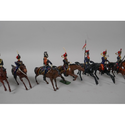 46 - Twenty five Britains mounted soldiers of various cavalry regiments, 9cm high