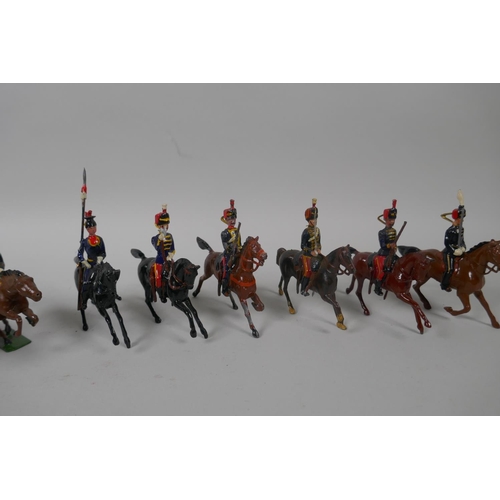 46 - Twenty five Britains mounted soldiers of various cavalry regiments, 9cm high