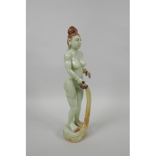 48 - An Oriental celadon green soapstone figure of a female goddess, 33cm high