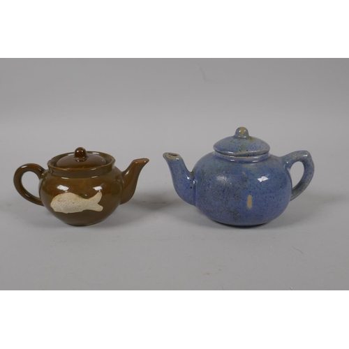 51 - A Chinese tea dust glazed porcelain teapot with raised carp decoration, and a similar blue speckle g... 