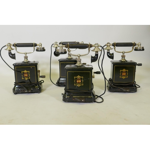 52 - Four early C20th Danish JYDSK Telefon Aktieselkab enamelled and chromed metal