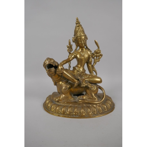 53 - A Tibetan bronze figure of Simhanada Avalokiteshvara, 22cm high