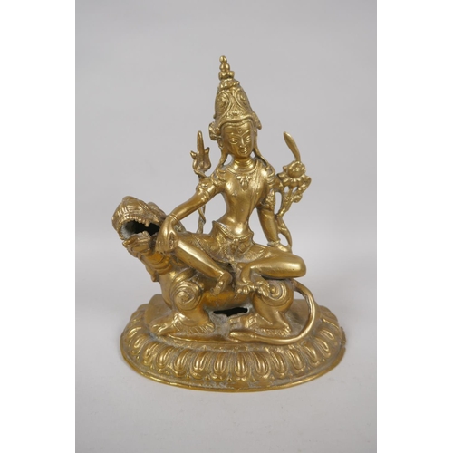 53 - A Tibetan bronze figure of Simhanada Avalokiteshvara, 22cm high