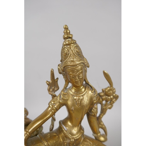 53 - A Tibetan bronze figure of Simhanada Avalokiteshvara, 22cm high