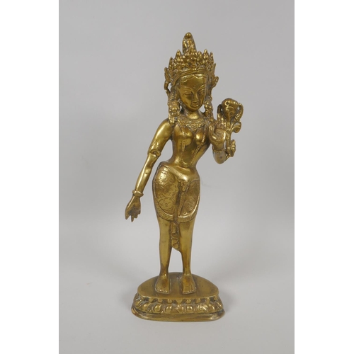 60 - An antique Tibetan brass figure of the goddess Tara, 29cm high