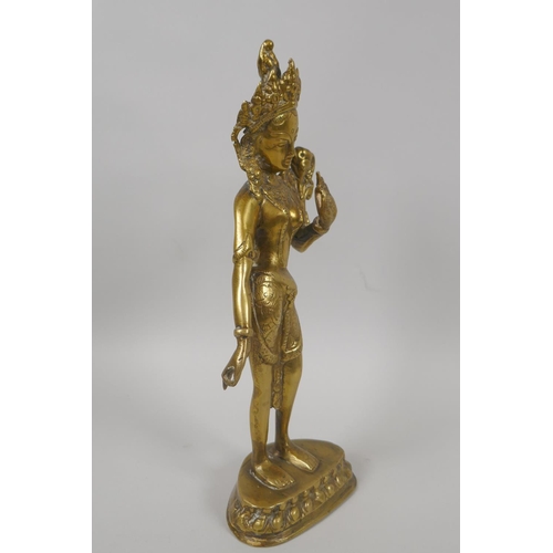 60 - An antique Tibetan brass figure of the goddess Tara, 29cm high