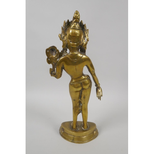 60 - An antique Tibetan brass figure of the goddess Tara, 29cm high